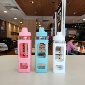 Three-piece square sports water bottle set with silicone sleeves and straw detail