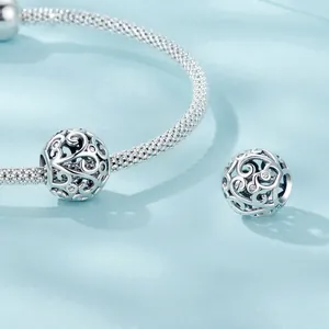 Elegant S925 sterling silver hollow vine charm with zirconia on a woven bracelet