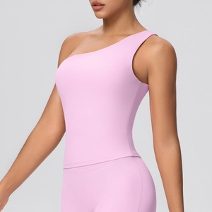 Detailed close-up of a high-elasticity pale pink one-shoulder yoga top for women