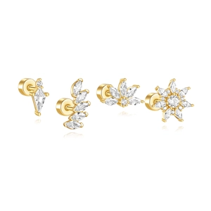Close-up of four 18K gold S925 silver stud earrings with zirconia on white background