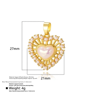 Detailed view of heart pendant featuring 18k gold plating and iridescent pearl inlay