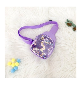 Macro detail of purple transparent PVC chest bag for kids with sparkling colorful glitter
