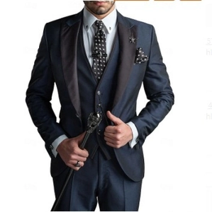 Detailed shot of dark blue three-piece suit with black silk shawl lapel and polka dot tie