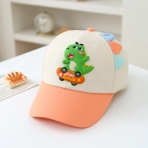 Detail of 3D rubber skateboard dinosaur and colorful fins on kids' cotton baseball cap
