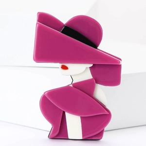 Fashionable Marilyn acrylic brooch with pink hat and dress on white background