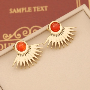 Golden fan-shaped stainless steel earrings with red natural stone in a modern design
