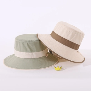 Detail view of two nylon bucket hats with adjustable windproof drawstrings and stitching