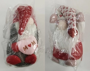 Detail of two faceless gnome dolls with hearts in transparent plastic packaging bags
