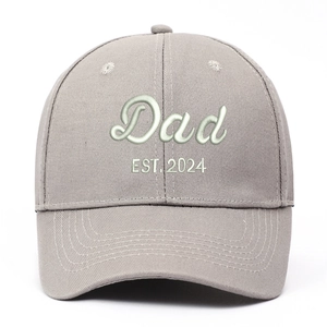 Close-up of Dad EST. 2024 embroidery on washed grey vintage style baseball cap