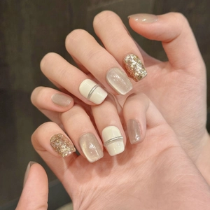 Champagne gold glitter and cream white cat-eye press-on nails in short square shape