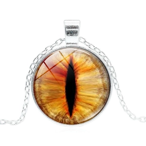 Detailed close-up of golden dragon eye glass pendant on a silver-tone necklace chain