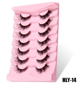 Detailed close-up of 7 pairs of handmade wispy false eyelashes in a pink display tray