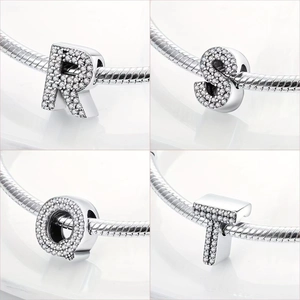 Silver plated alphabet charms R S Q T with sparkling pavé crystals on a snake chain bracelet
