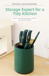 Detail view of a green rotating knife holder with vertical texture and multi-slot top