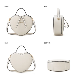 Detailed views of the heart-shaped white crossbody bag with crossgrain leather texture