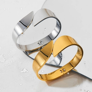 Polished stainless steel adjustable open bangles in gold and silver leaf-shaped design