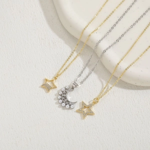 Three-piece luxury celestial necklace set with pearls, stars, moon and zircons in gold and silver