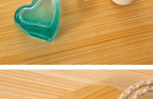 Detail view of heart-shaped green glass bottle with wooden lid and hemp rope handle