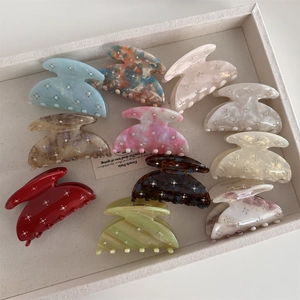 Star rhinestone acetate hair clips with marble patterns in diverse vibrant colors