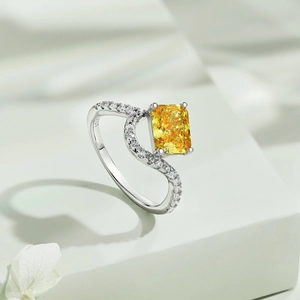 Close-up of S925 sterling silver ring featuring a yellow emerald-cut zircon and pave stones