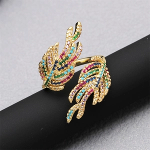 Macro detail of 18K gold-plated double feather ring with multi-color zircon inlay