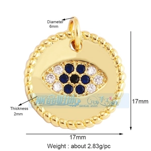 Macro view of gold plated Evil Eye charm with blue cubic zirconia and rope texture detail