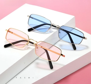 Detail of retro small rectangle metal sunglasses in light blue and pink color variants
