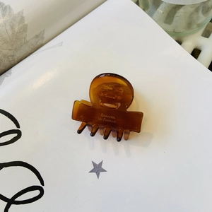Brown tortoise shell acetate hair claw clip with gold Barrette la France lettering