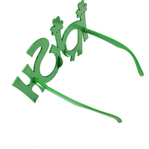 Detail view of Irish letters and shamrock patterns on green St. Patrick's Day glasses