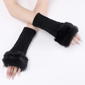 Detail of black cable-knit arm warmers featuring plush faux fur trim and fingerless design