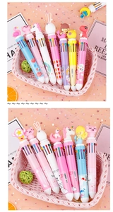 Close-up of colorful cartoon 10-color shuttle pens in a cute pink storage basket