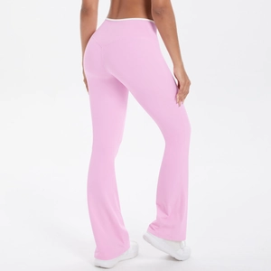 Rear view of pink high-waisted flared yoga pants with white piping and Y-shaped seam