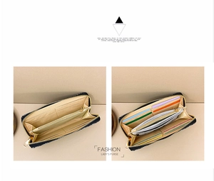 Detail view of large capacity long wallet interior showing multiple card slots and zip pocket