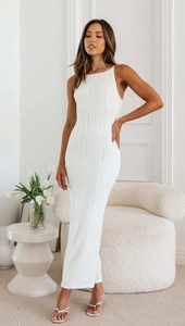Close-up of the textured wave pattern fabric on this elegant white backless dress