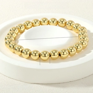 Detailed view of 8mm 18K gold plated stretch bead bracelet with 16-17cm circumference