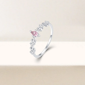 Detail of 925 silver ring featuring a pink marquise gemstone and micro-pave crystals