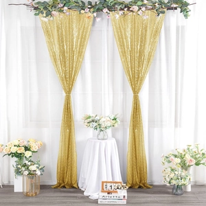 Close-up of sparkling gold sequin curtains backdrop for wedding and event decoration