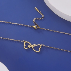 Detail of gold MOM necklace with heart pendant and adjustable lobster clasp on display