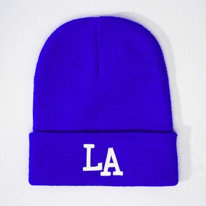 Royal blue knitted beanie with white 3D embroidered LA logo and folded brim style