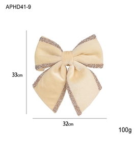 Detail of large cream velvet Christmas bow with glitter edges, sized 33x32cm