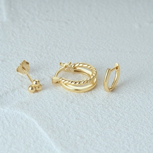 Detail view of gold S925 sterling silver butterfly geometric hoop and stud earring set