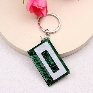 Retro green transparent cassette tape keychain with silver ring and FRIEND text engraving