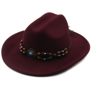 Detail of wool fedora hat with burgundy wide brim and ethnic beaded band with turquoise