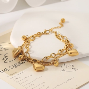 Double-layered 18K gold plated stainless steel bracelet with hollow heart and bead charms