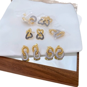 Elegant gold and silver double-layer earrings with sparkling zircon crystals in a cross design