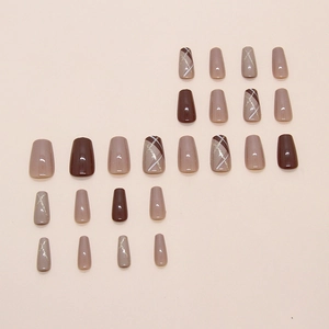 Brown and nude coffin press-on nails set with glitter lines and marble patterns