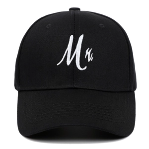Black cotton baseball cap featuring white Mr. letter embroidery and curved brim