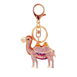 Sparkling pink rhinestone camel keychain with gold finish and colorful enamel saddle