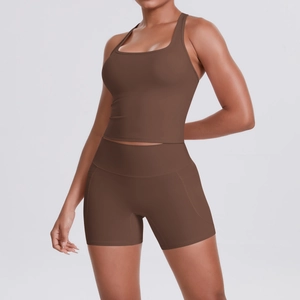 Detail of brown racerback sports bra and high-waisted gym shorts with side pockets