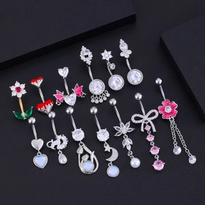 Detailed showcase of diverse zircon belly rings with floral, heart, and butterfly designs